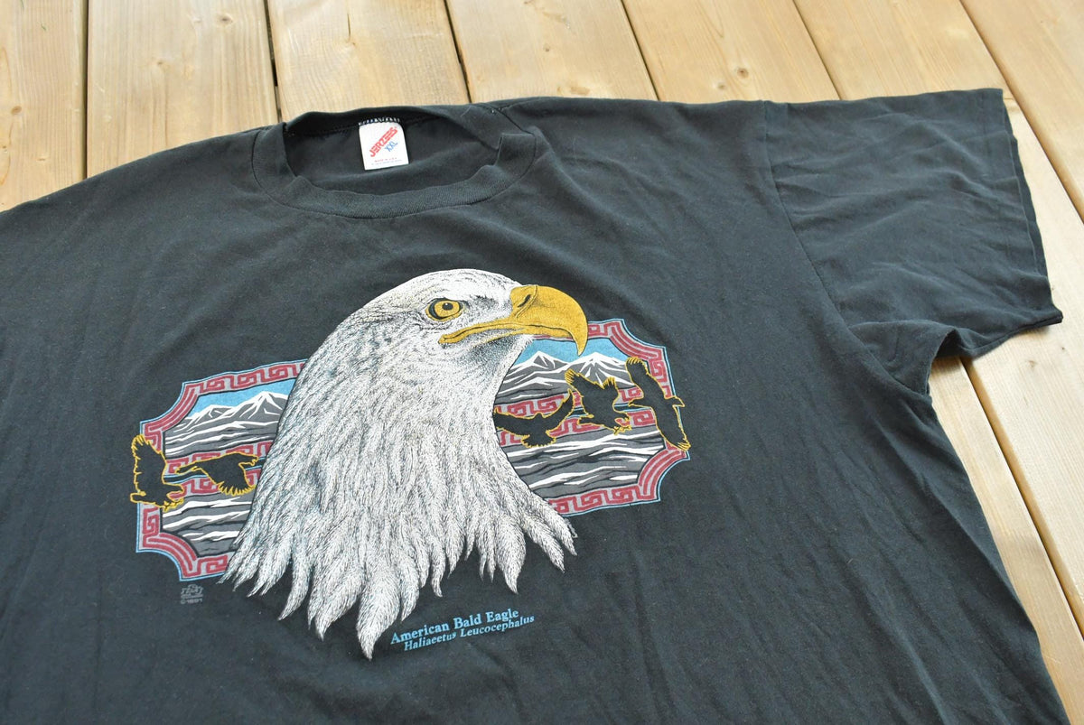Vintage 1990s Jerzees American Eagle Bald Eagle Graphic T Shirt Men's XL from propervintagecanada