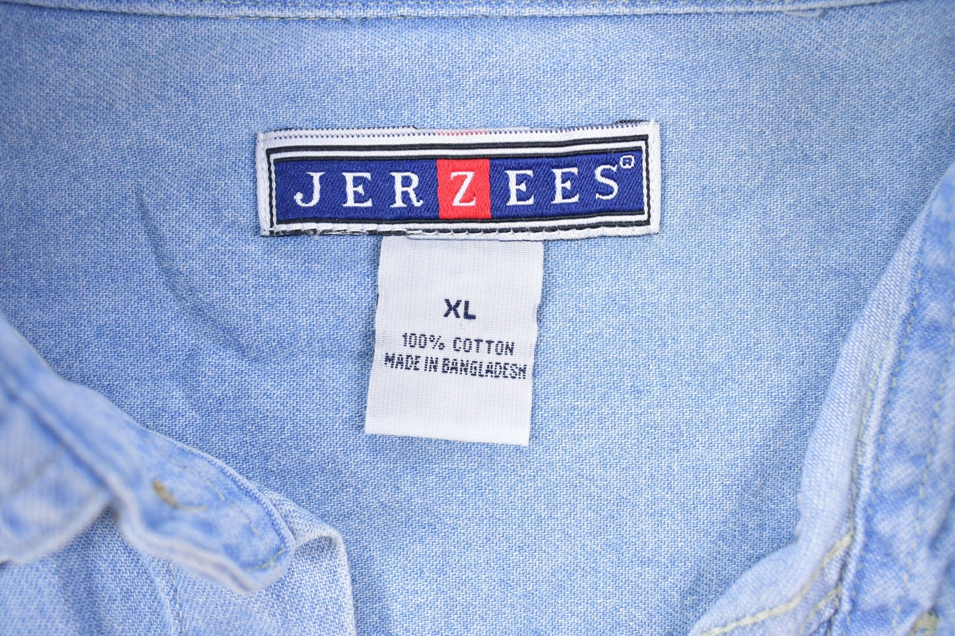 Vintage 1990s Jerzees Skull Back Print Denim Button Up Shirt Men's XL from propervintagecanada