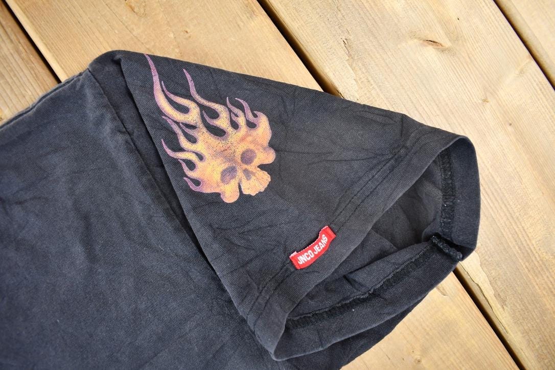 Vintage 1990s JNCO Jeans Skull Flame Graphic T Shirt Men's Large from propervintagecanada