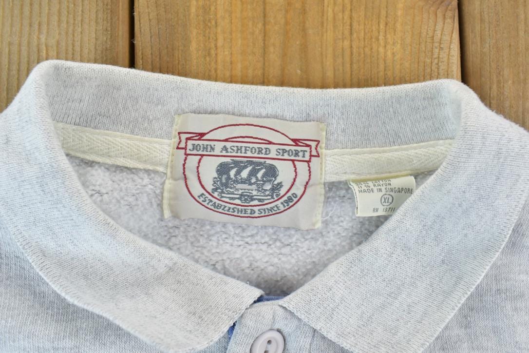 Vintage 1990s John Ashford Sport Colour Block Souvenir Crewneck Sweatshirt Men's XL from propervintagecanada
