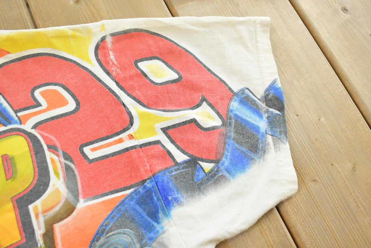 Vintage 1990s Kevin Harvick Looney Tunes All Over Print All Tuned Up NASCAR Racing T-Shirt Mens L from propervintagecanada
