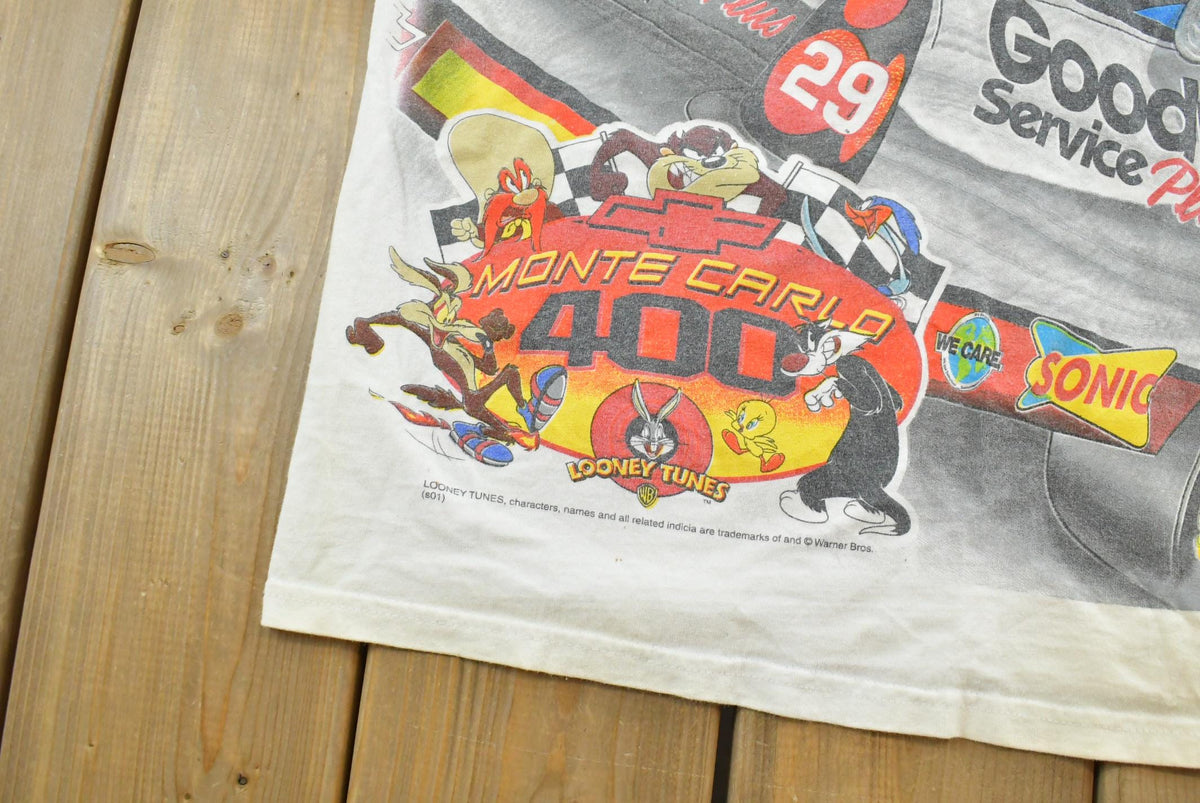 Vintage 1990s Kevin Harvick Looney Tunes All Over Print All Tuned Up NASCAR Racing T-Shirt Mens L from propervintagecanada