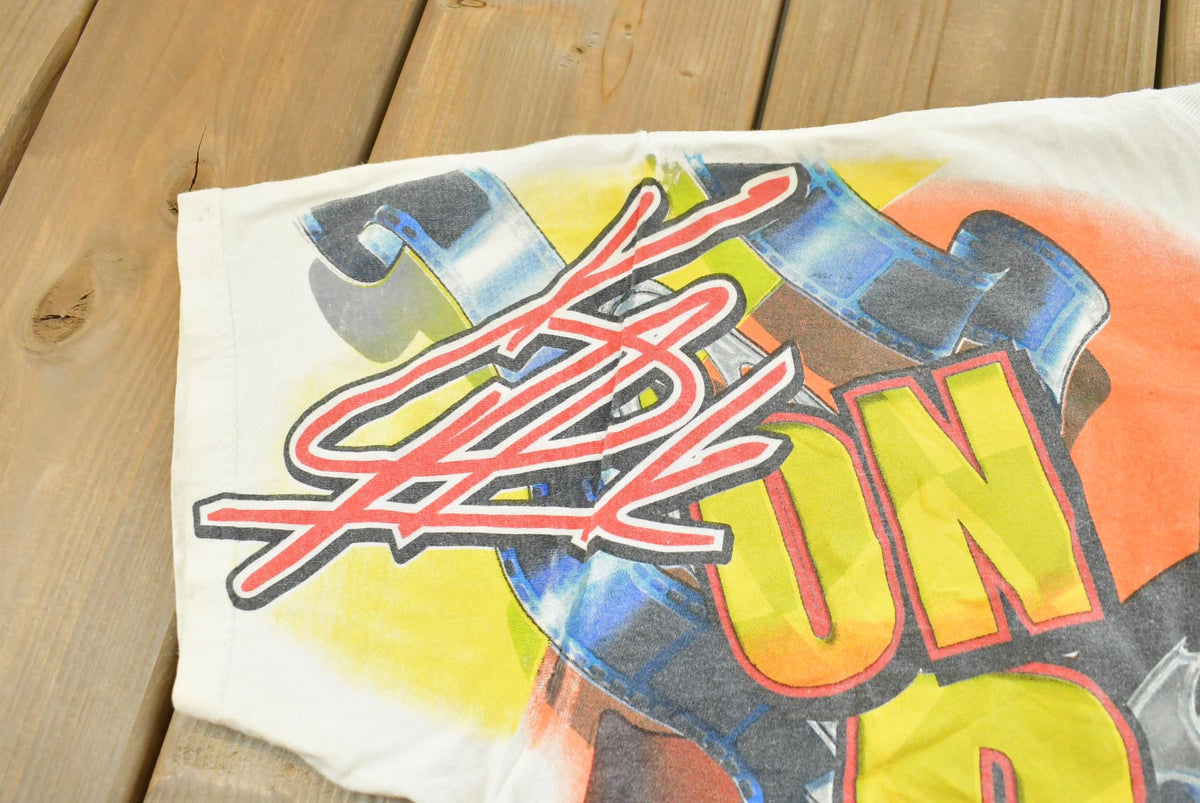 Vintage 1990s Kevin Harvick Looney Tunes All Over Print All Tuned Up NASCAR Racing T-Shirt Mens L from propervintagecanada
