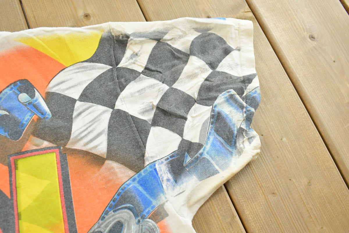 Vintage 1990s Kevin Harvick Looney Tunes All Over Print All Tuned Up NASCAR Racing T-Shirt Mens L from propervintagecanada
