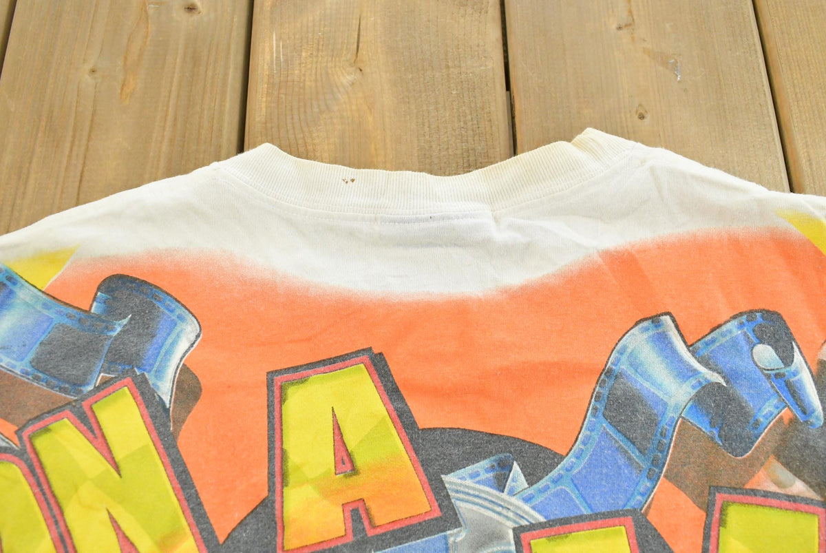 Vintage 1990s Kevin Harvick Looney Tunes All Over Print All Tuned Up NASCAR Racing T-Shirt Mens L from propervintagecanada