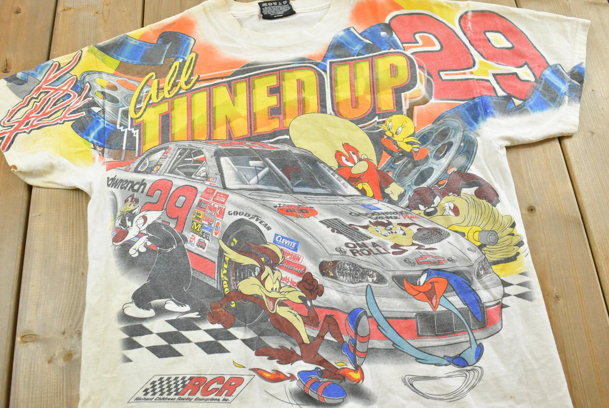 Vintage 1990s Kevin Harvick Looney Tunes All Over Print All Tuned Up NASCAR Racing T-Shirt Mens L from propervintagecanada