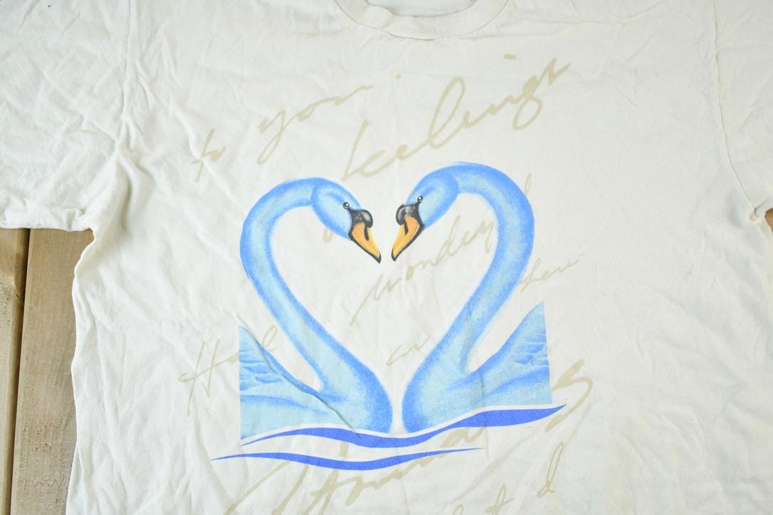 Vintage 1990s Kissing Love Swans Souvenir Single Stitch Graphic Print T-Shirt Men's XL from propervintagecanada