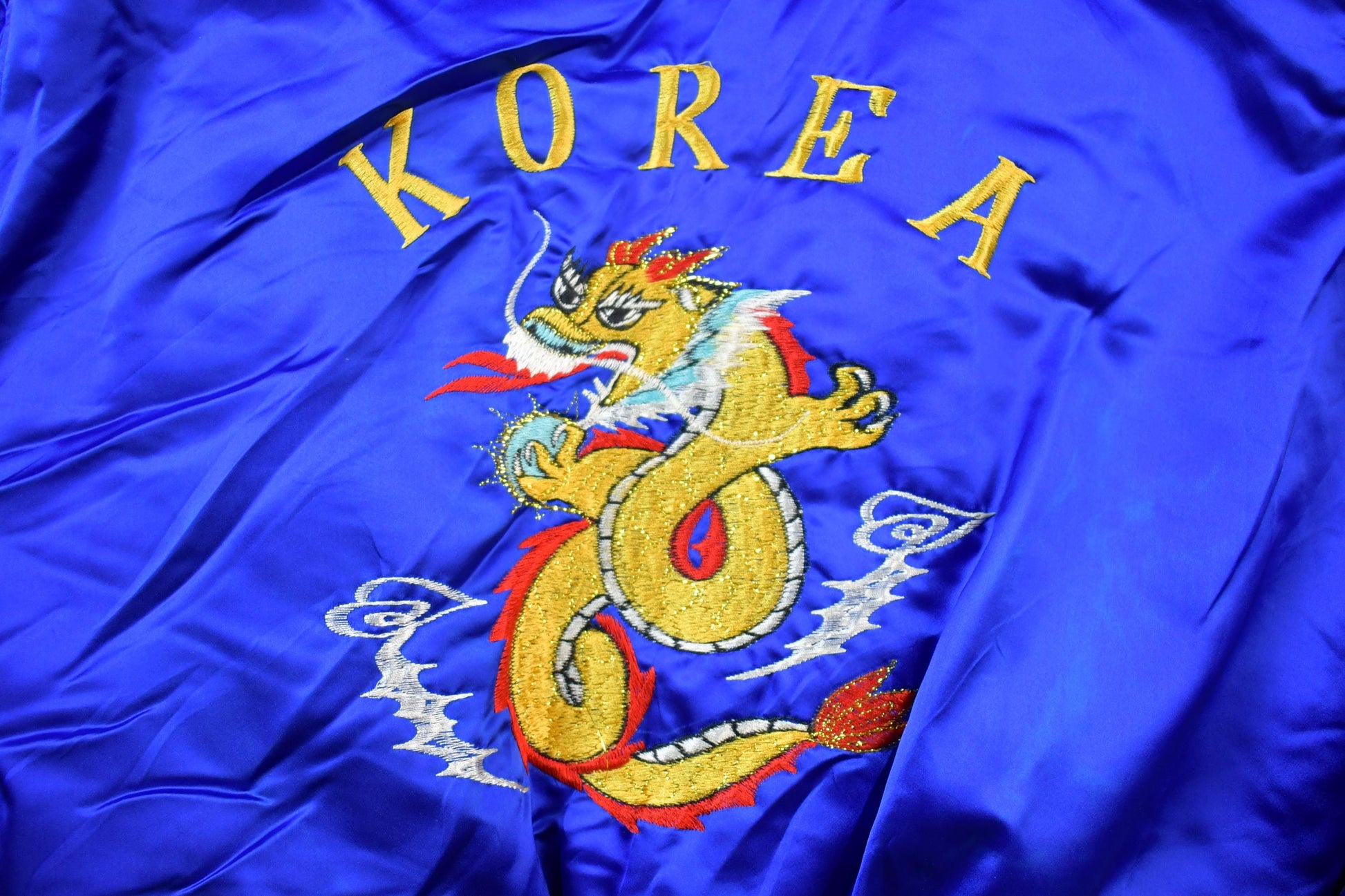 Vintage 1990s Korea Dragon Hooded Puffer Jacket from propervintagecanada