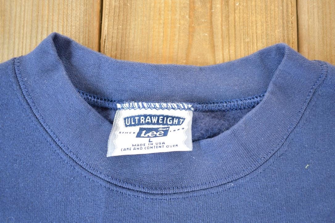 Vintage 1990s Lee Ultraweight Souvenir Crewneck Sweatshirt Made In USA Men's XL from propervintagecanada