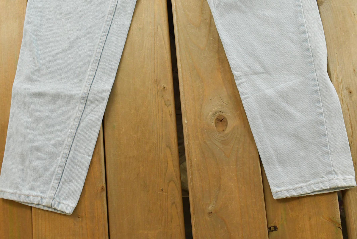 Vintage 1990s Levi's 550 Relaxed Fit Denim Light Wash Blue Jeans Men's 26 x 30 from propervintagecanada
