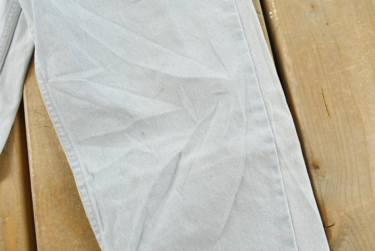 Vintage 1990s Levi's 550 Relaxed Fit Denim Light Wash Blue Jeans Men's 26 x 30 from propervintagecanada