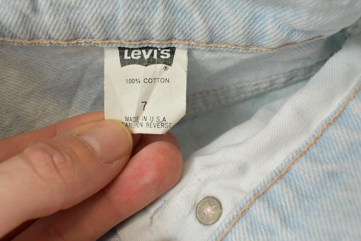Vintage 1990s Levi's 550 Relaxed Fit Denim Light Wash Blue Jeans Men's 26 x 30 from propervintagecanada