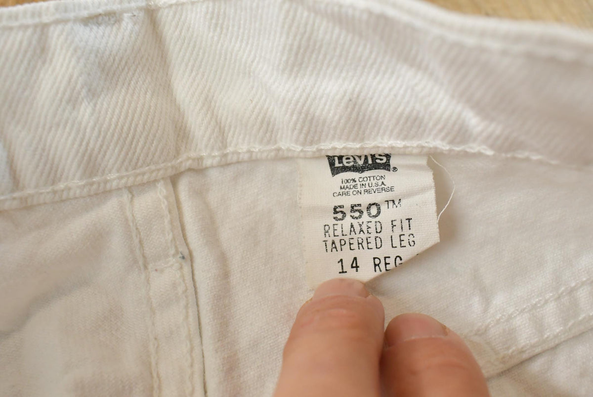 Vintage 1990s Levi's 550 Relaxed Fit Tapered Leg Denim White Jeans Women's 22 x 24.5 from propervintagecanada