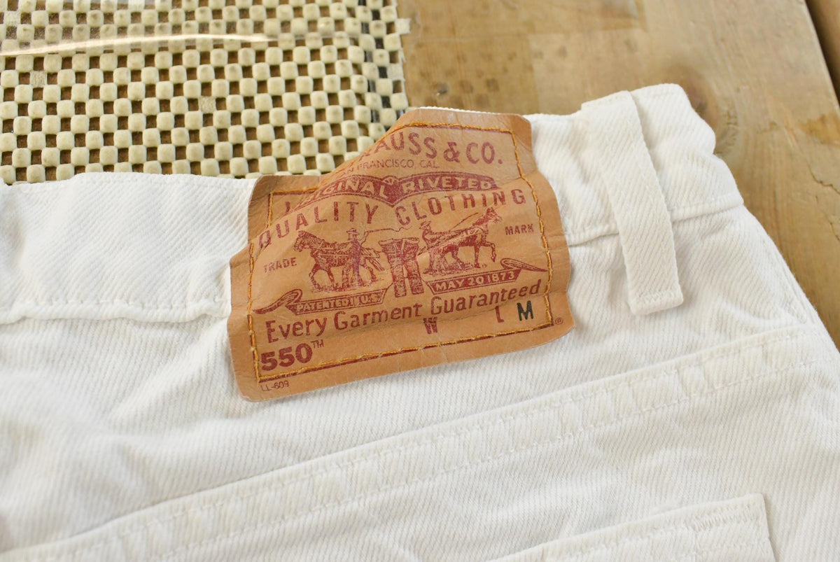 Vintage 1990s Levi's 550 Relaxed Fit Tapered Leg Denim White Jeans Women's 22 x 24.5 from propervintagecanada