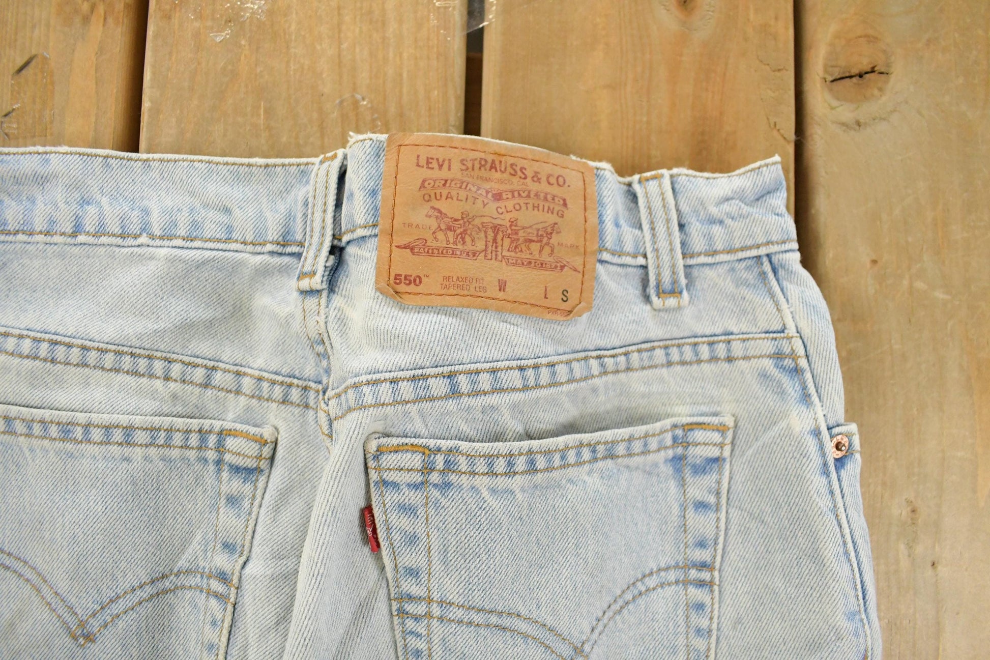 Vintage 1990s Levi's 550 Relaxed Tapered Fit Denim Jeans Women's 29 x 29 / 90s Levi's / Distressed Sun Faded Jeans / Made in Canada from propervintagecanada