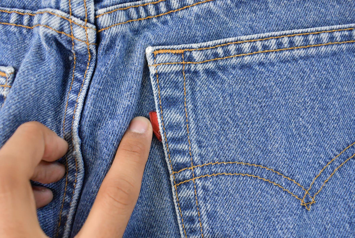 Vintage 1990s Levi's 551 Relaxed Tapered Fit Denim Jeans Women's 33 x 30 from propervintagecanada