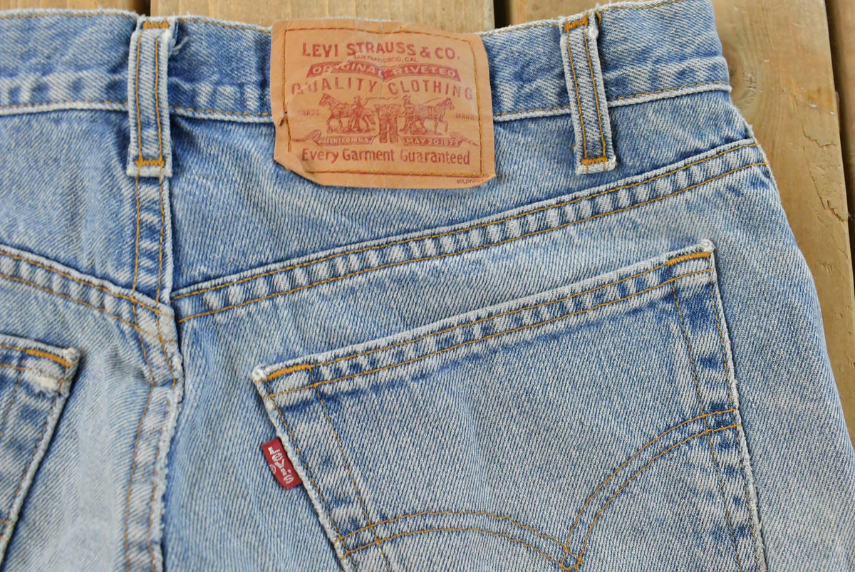 Vintage 1990s Levi's Distressed 505 Regular Straight Denim Jeans Men's 33 x 32 from propervintagecanada