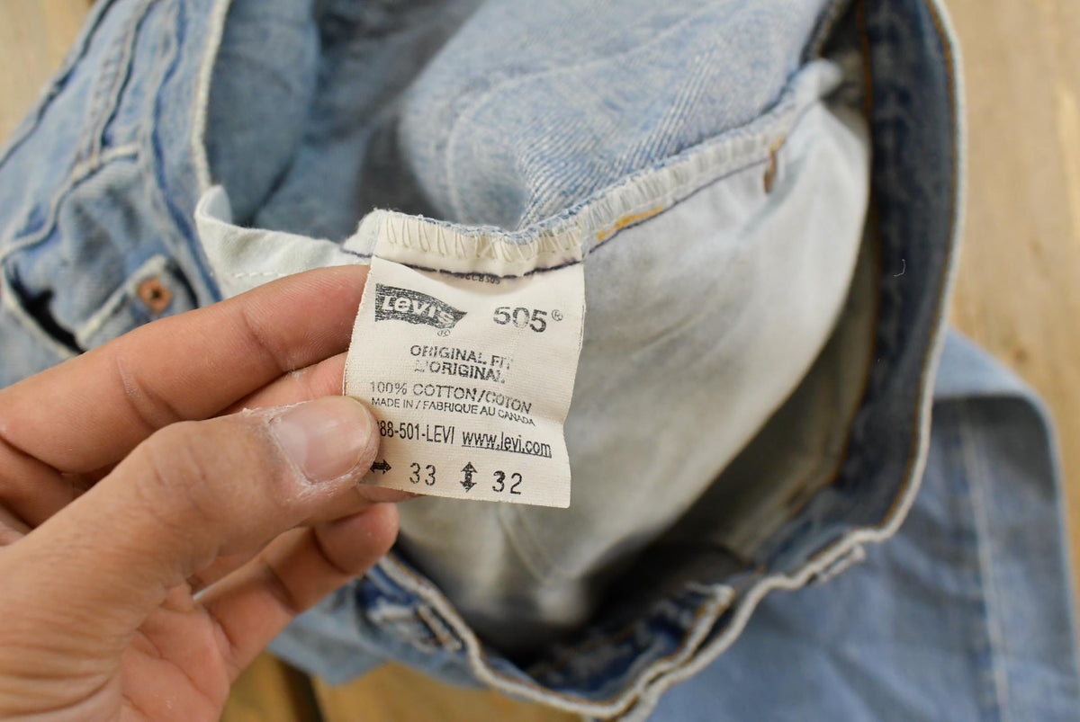 Vintage 1990s Levi's Distressed 505 Regular Straight Denim Jeans Men's 33 x 32 from propervintagecanada