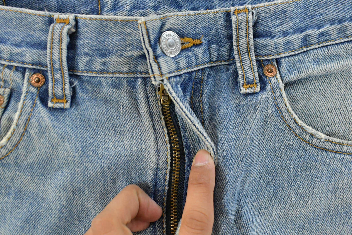 Vintage 1990s Levi's Distressed 505 Regular Straight Denim Jeans Men's 33 x 32 from propervintagecanada