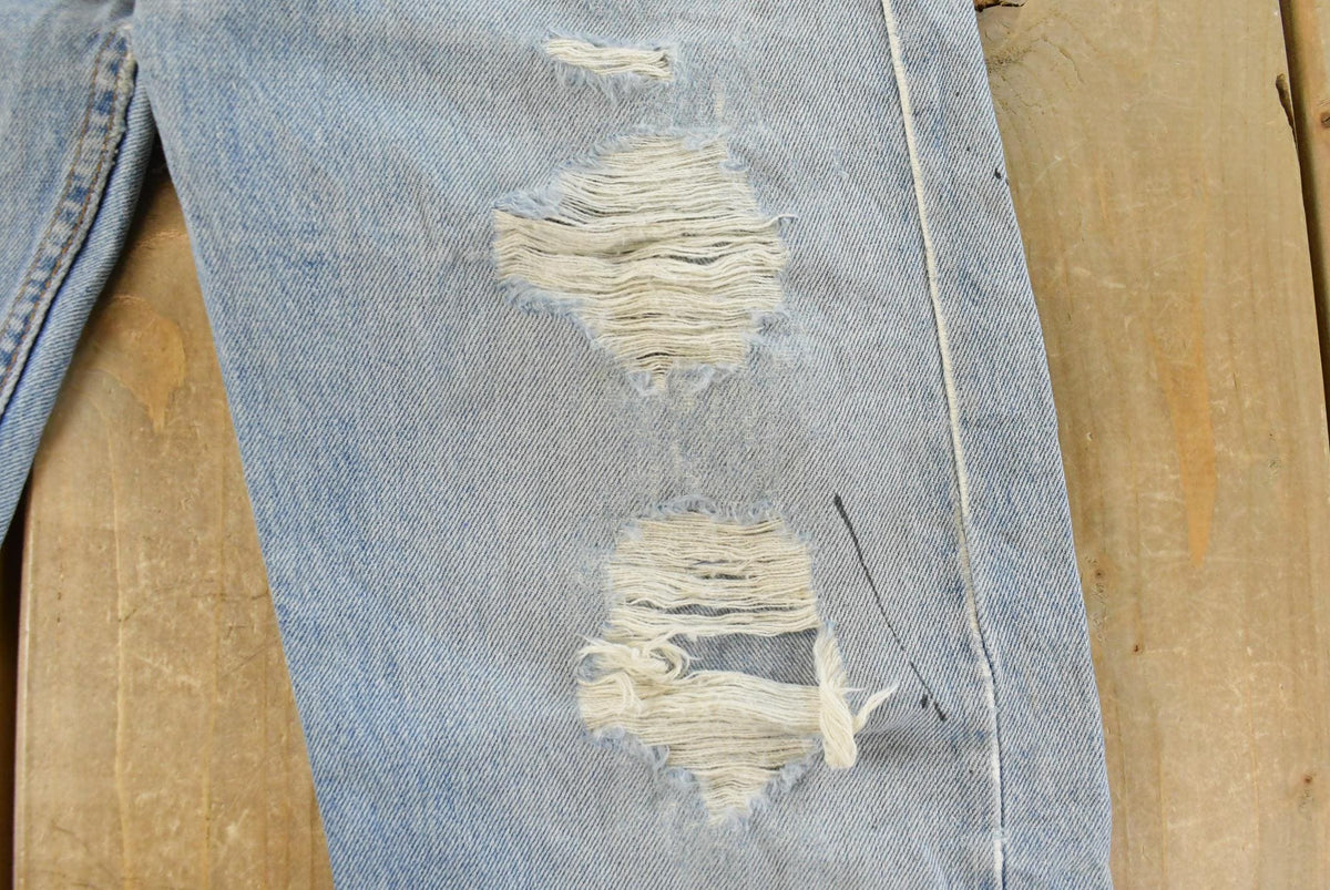 Vintage 1990s Levi's Distressed 505 Regular Straight Denim Jeans Men's 33 x 32 from propervintagecanada