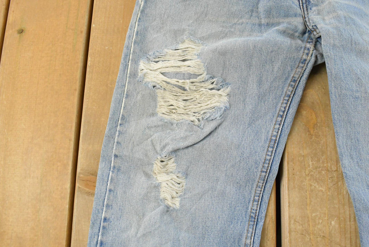 Vintage 1990s Levi's Distressed 505 Regular Straight Denim Jeans Men's 33 x 32 from propervintagecanada