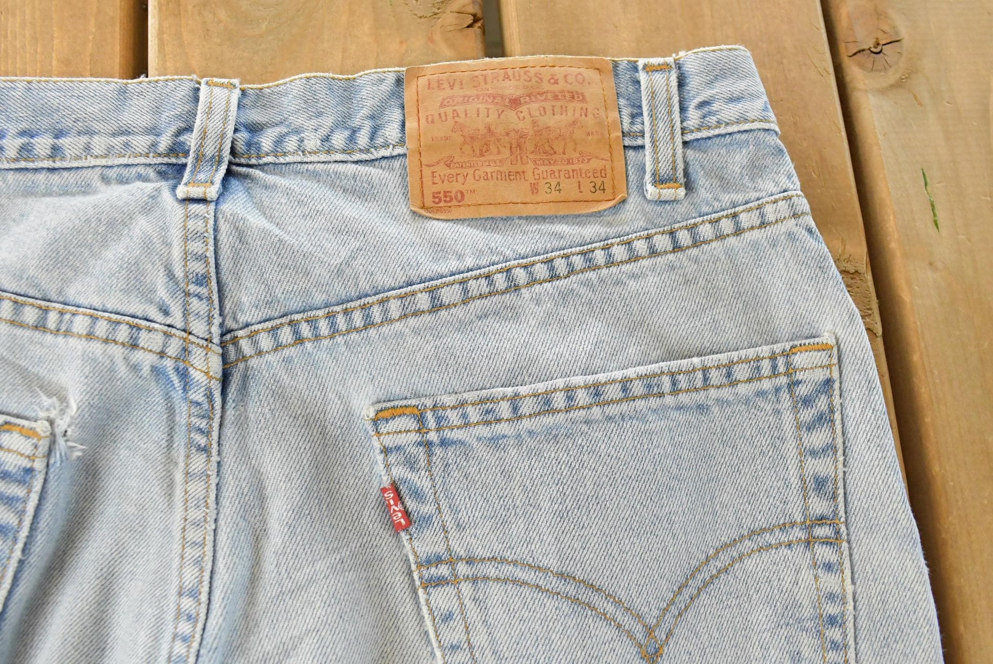 Vintage 1990s Levi's Distressed 550 Relaxed Fit Denim Jeans Men's 33 x 33 from propervintagecanada