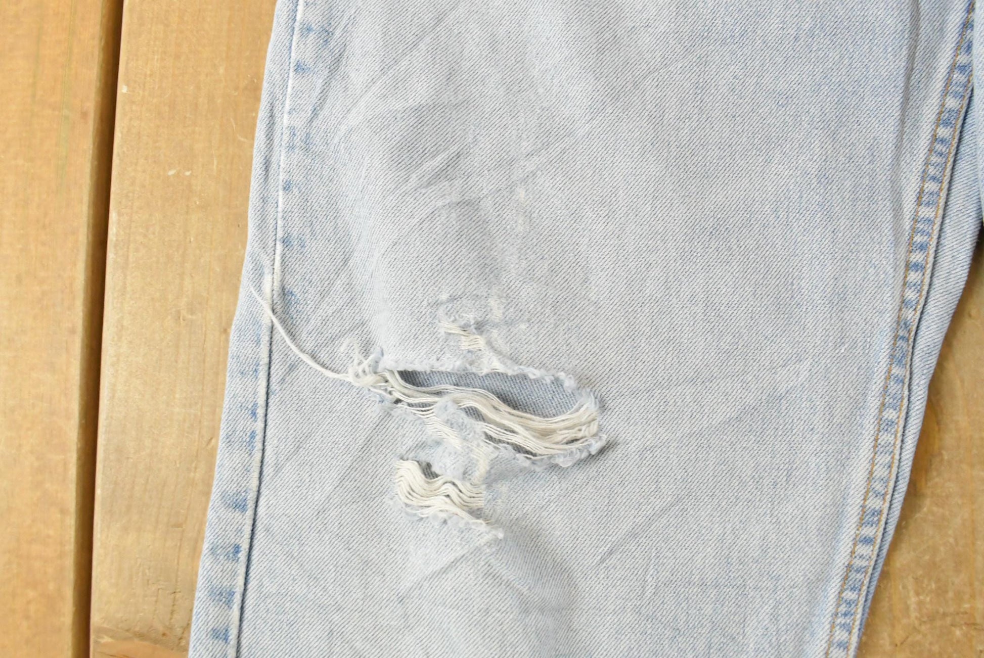 Vintage 1990s Levi's Distressed 550 Relaxed Fit Denim Jeans Men's 33 x 33 from propervintagecanada