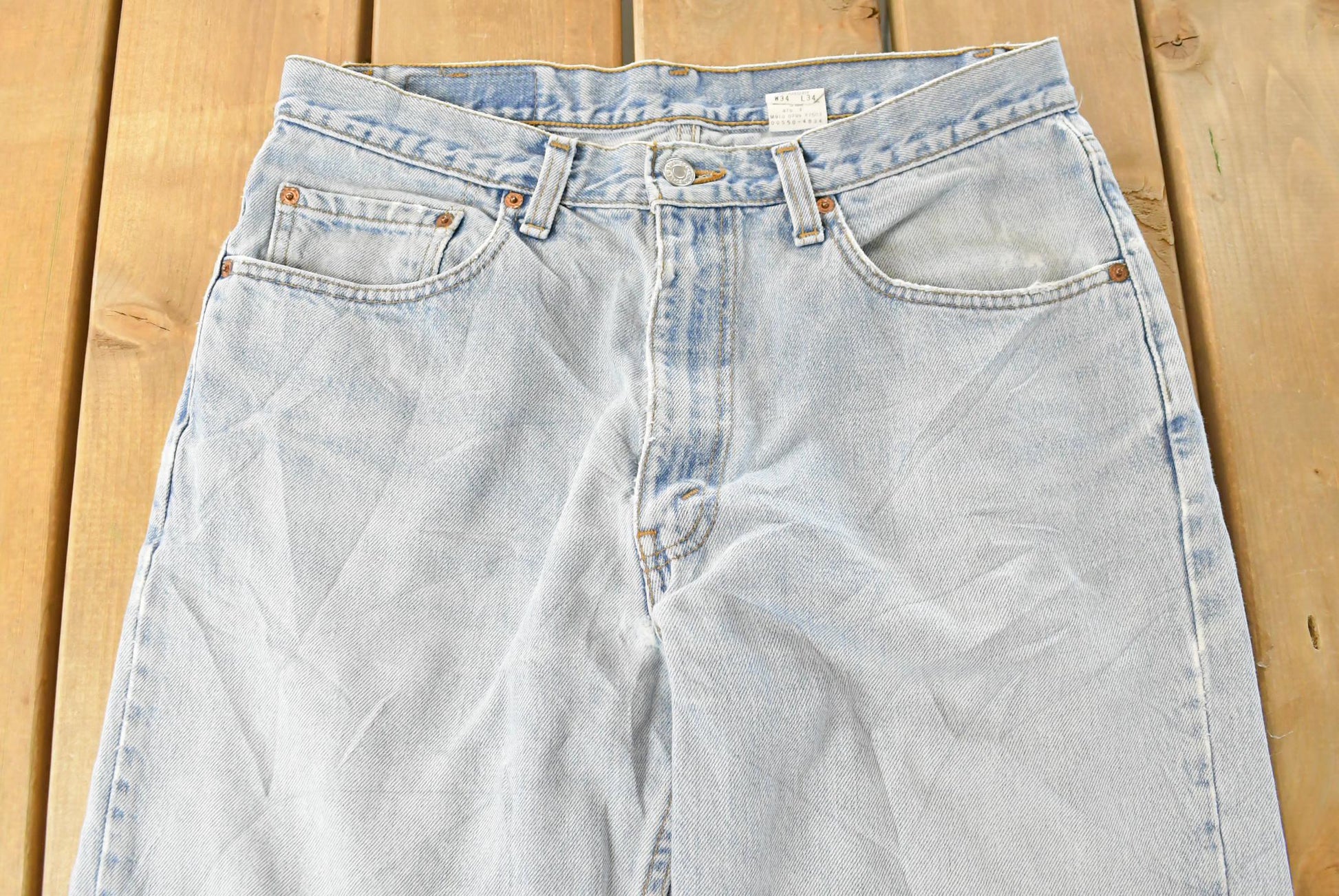 Vintage 1990s Levi's Distressed 550 Relaxed Fit Denim Jeans Men's 33 x 33 from propervintagecanada
