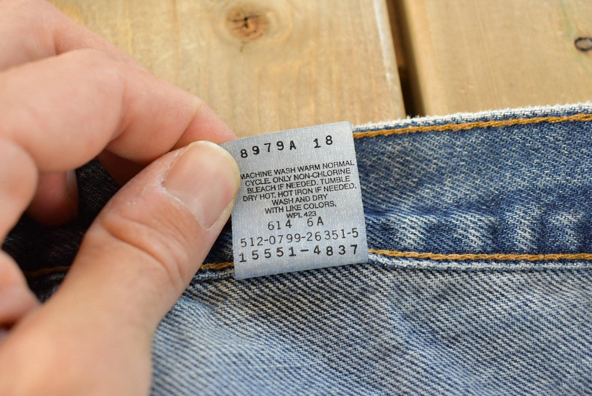 Vintage 1990s Levi's Distressed 550 Relaxed Fit Denim Jeans Women's 33 x 32.5 from propervintagecanada