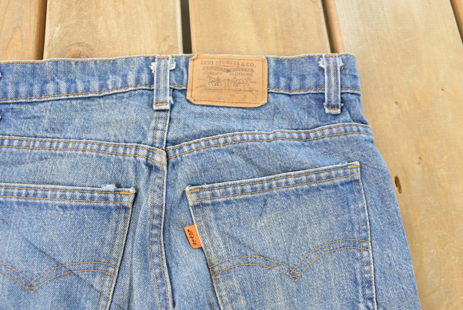 Vintage 1990s Levi's Distressed 716 Orange Tab Student Denim Jeans Men's 28 x 31 from propervintagecanada