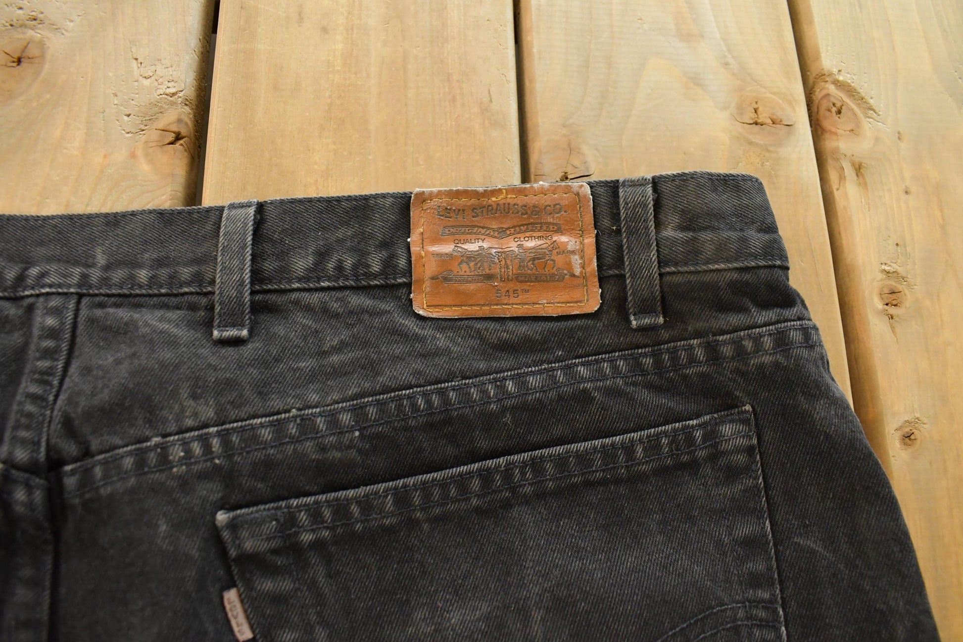 Vintage 1990s Levi's Loose Fit Denim Jeans Men's 46 x 27 / 90s Levi's / Distressed Sun Faded Jeans / Made in USA from propervintagecanada