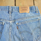 Vintage 1990s Levi's Paint Distressed Orange Tab Denim Jeans Men's 34 x 34 from propervintagecanada