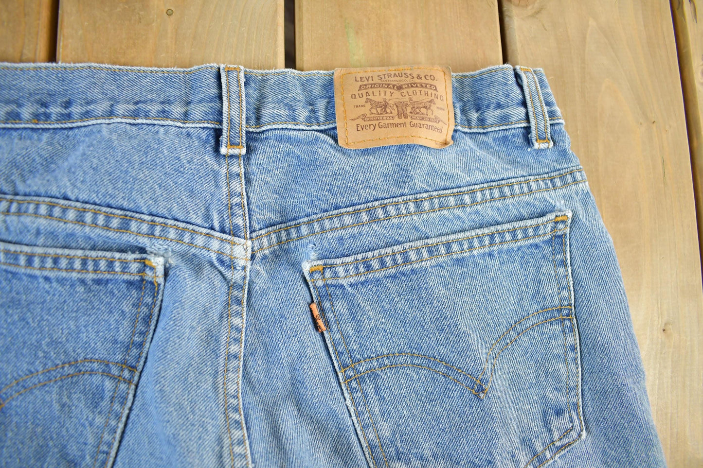 Vintage 1990s Levi's Paint Distressed Orange Tab Denim Jeans Men's 34 x 34 from propervintagecanada