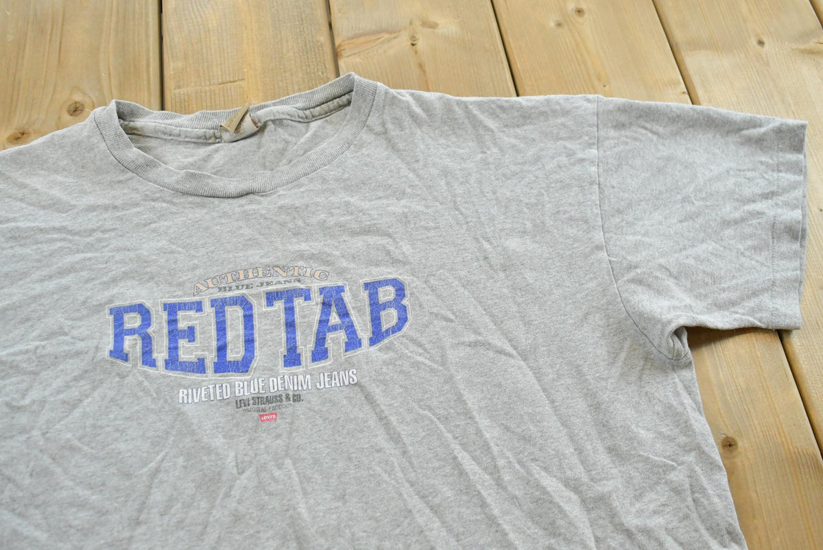 Vintage 1990s Levis Red Tab Denim Graphic T-Shirt Mens M from propervintagecanada