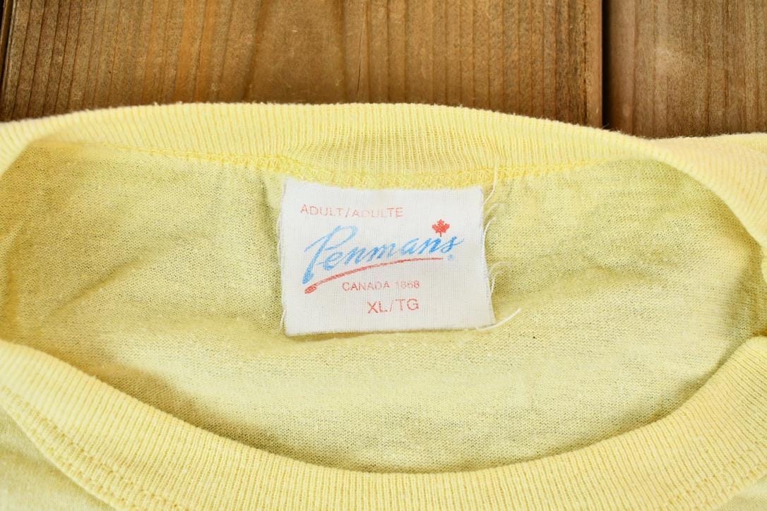 Vintage 1990s Light Yellow Penmans CFB Gagetown Short Course Triathlon Single Stitch Graphic T-Shirt Men's Large from propervintagecanada