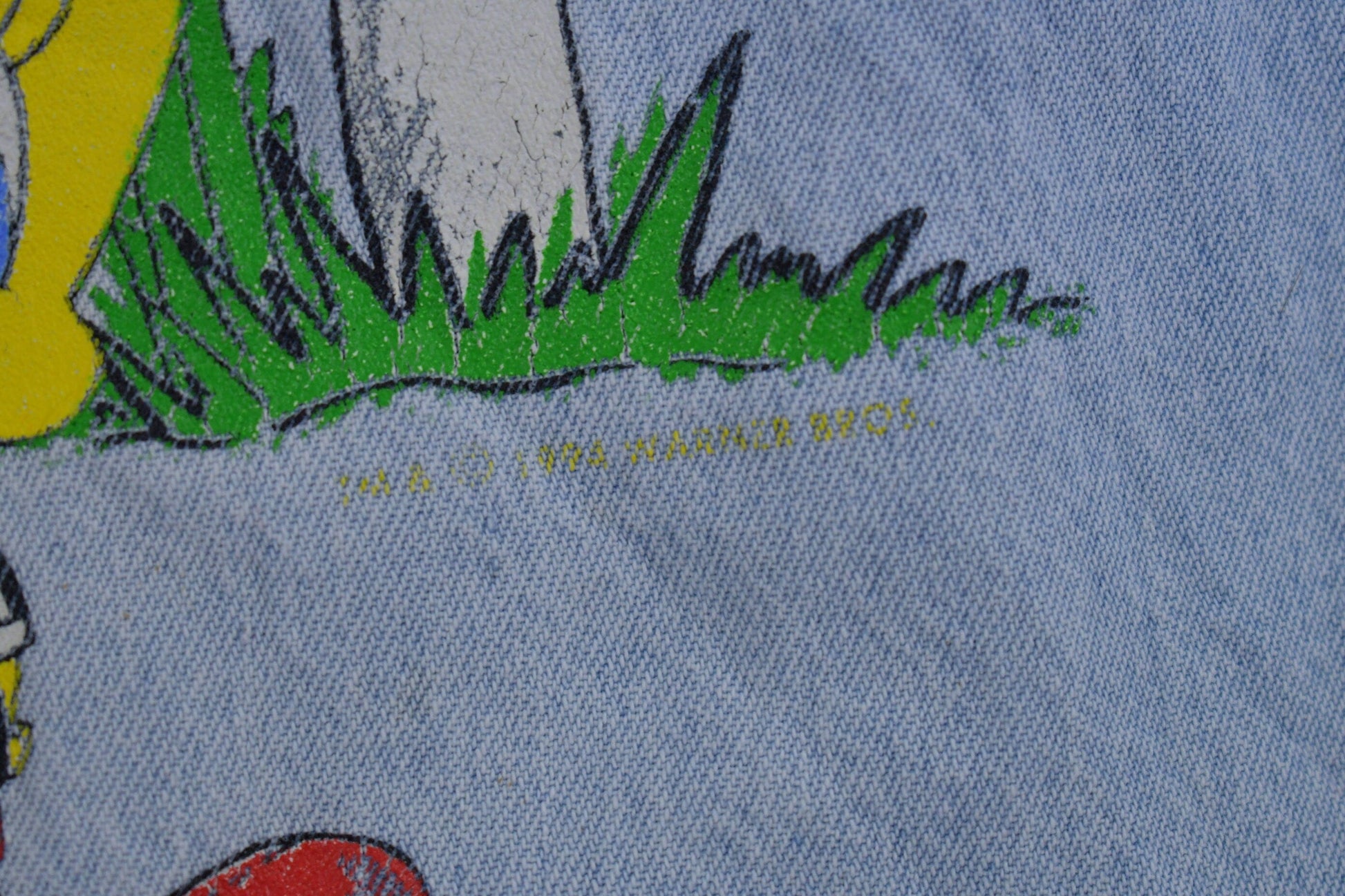 Vintage 1990s Looney Tunes Embroidered Button Up Denim Shirt Men's Medium from propervintagecanada