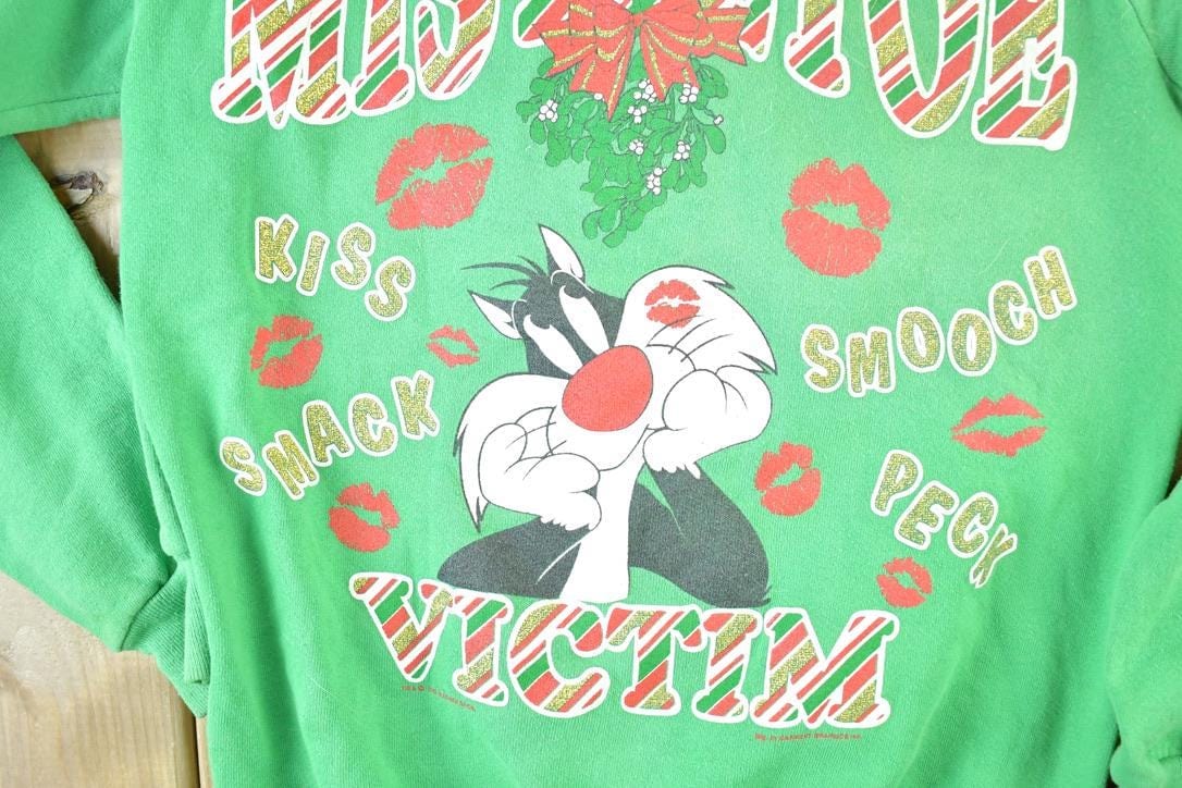 Vintage 1990s Looney Tunes Mistletoe Victim Crewneck Mens M from propervintagecanada