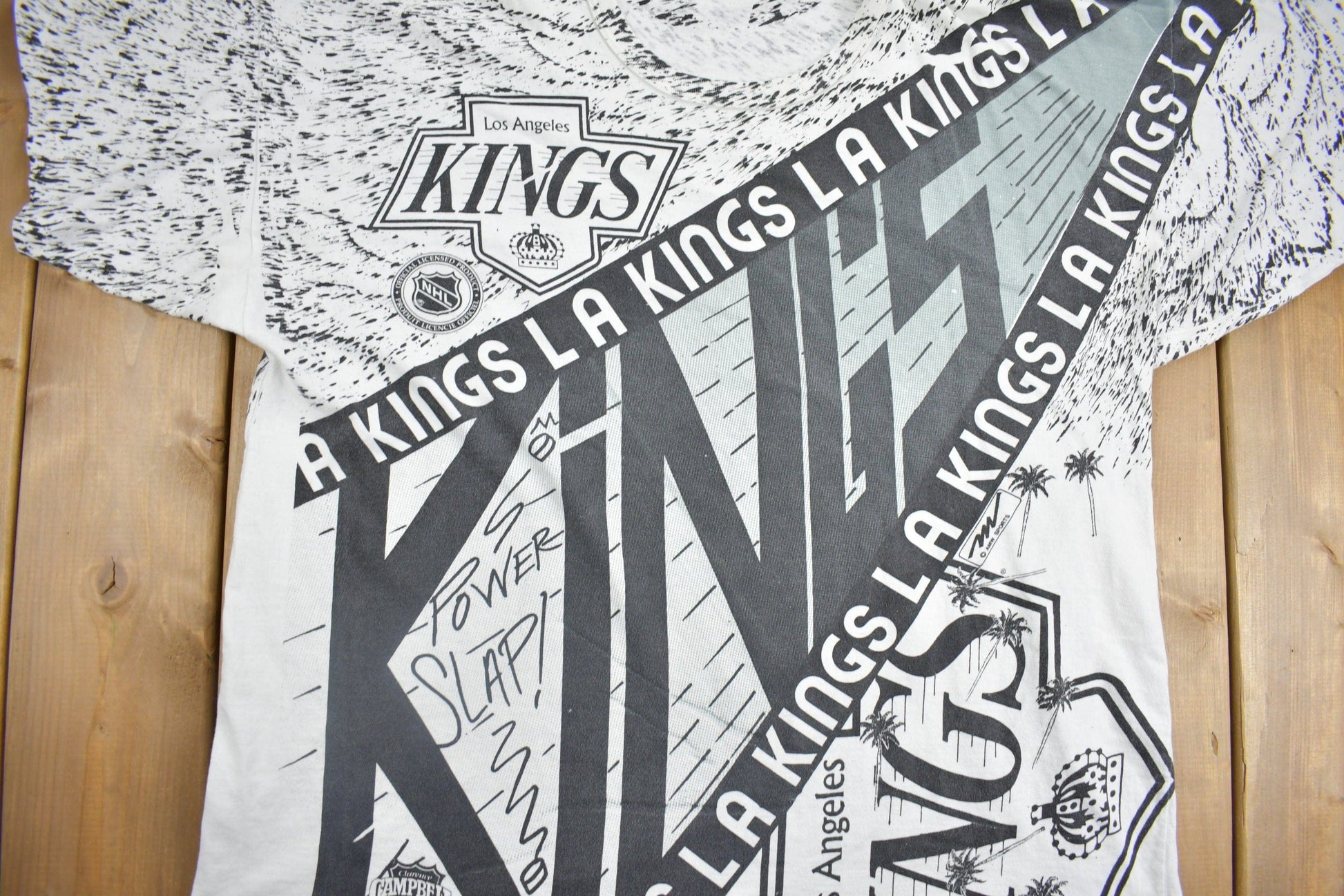 Vintage 1990s Los Angeles Kings NHL All Over Print Graphic T-Shirt Men's 2XL from propervintagecanada
