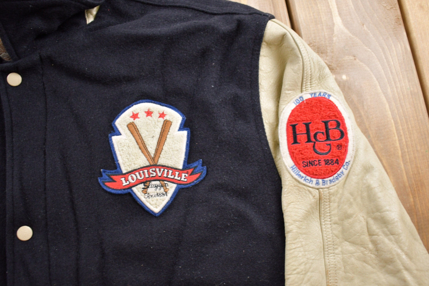 Vintage 1990s Louisville Slugger Baseball Wool With Leather Sleeves Varsity Jacket Cooper Collection Men's XL from propervintagecanada