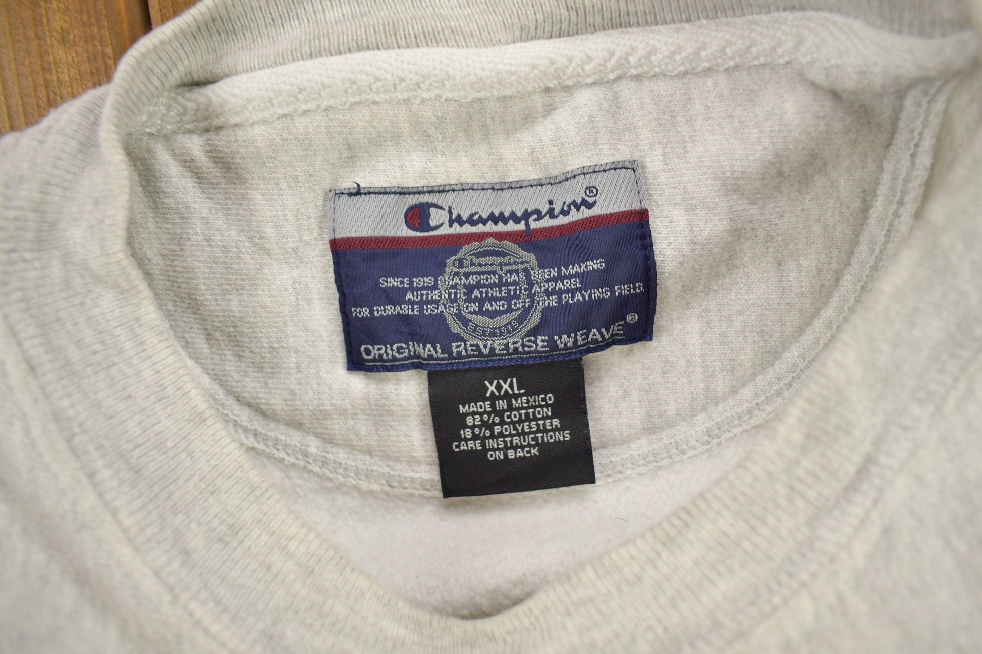 Vintage 1990s Marquette University Champion Reverse Weave Crewneck Sweatshirt Men's 2XL from propervintagecanada