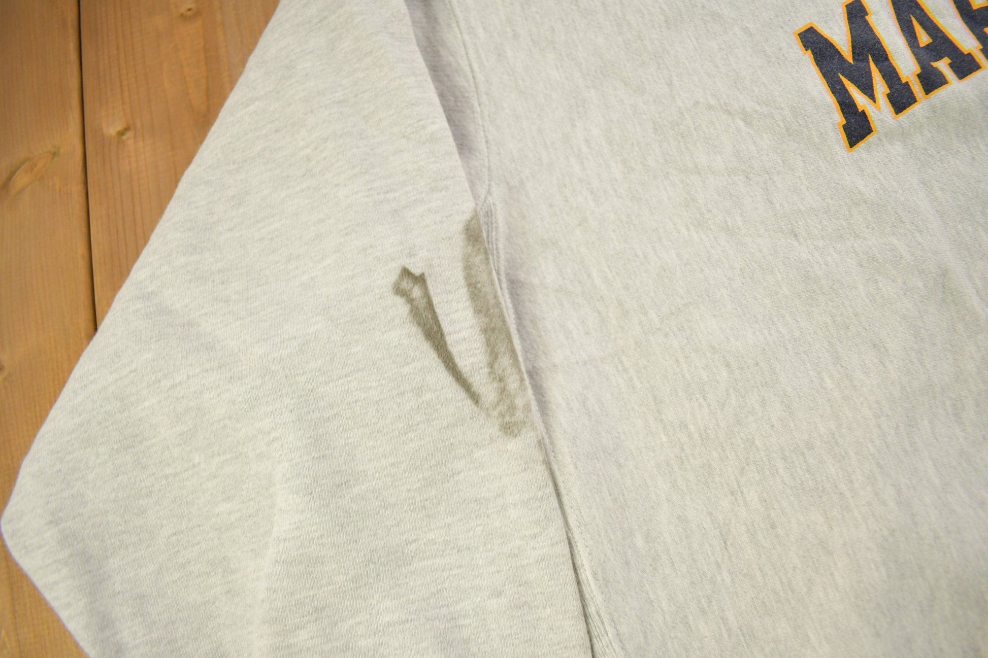 Vintage 1990s Marquette University Champion Reverse Weave Crewneck Sweatshirt Men's 2XL from propervintagecanada