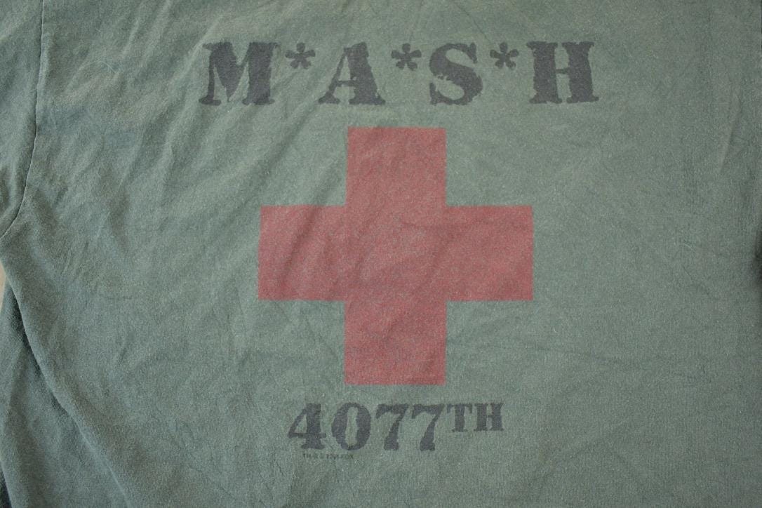 Vintage 1990s MASH Souvenir Single Stitch Graphic Print T-Shirt Men's Large from propervintagecanada