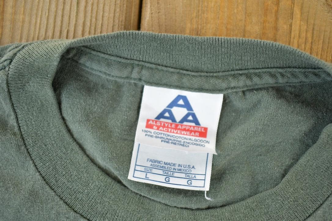 Vintage 1990s MASH Souvenir Single Stitch Graphic Print T-Shirt Men's Large from propervintagecanada