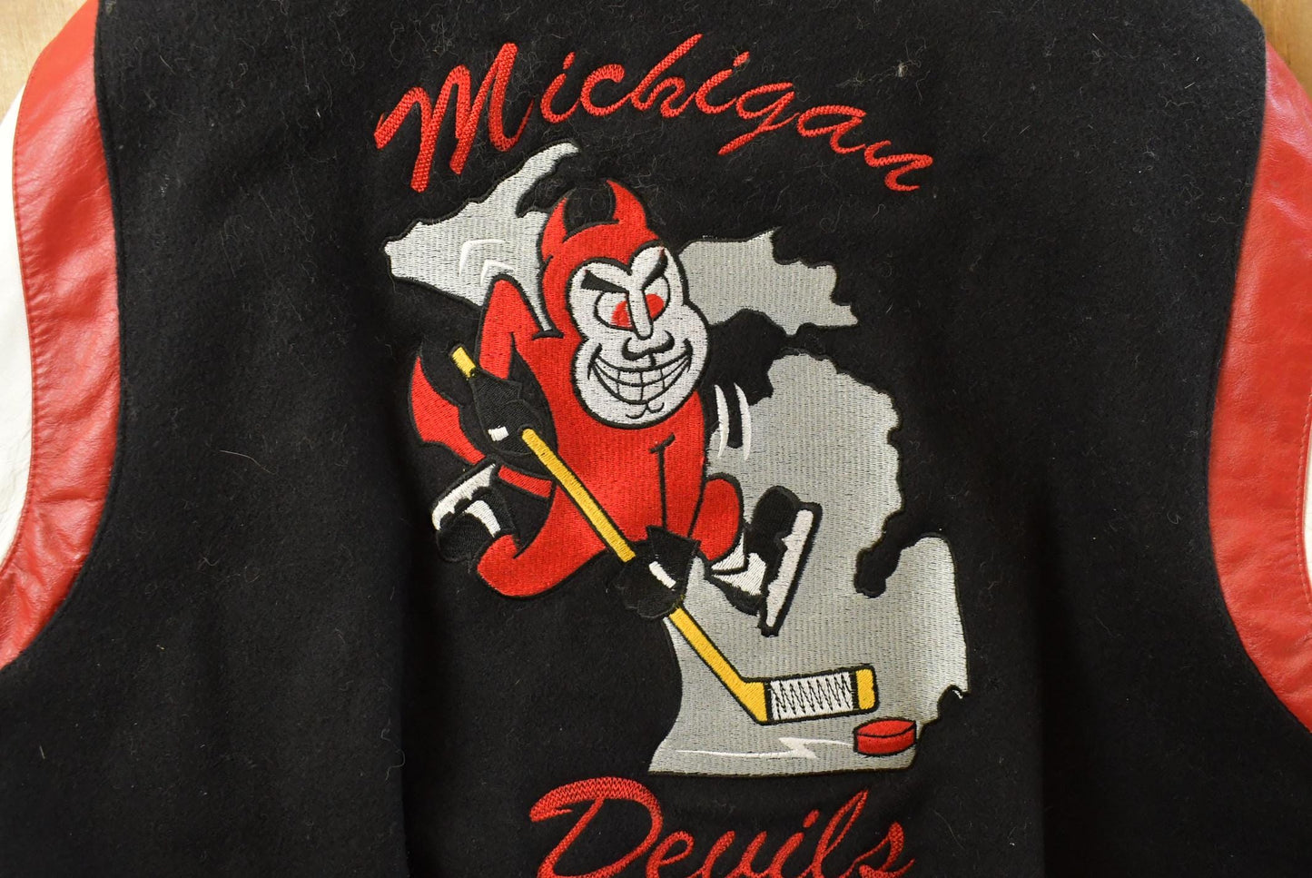 Vintage 1990s Michigan Devils Hockey Wool Leather Varsity Jacket Men's XL from propervintagecanada