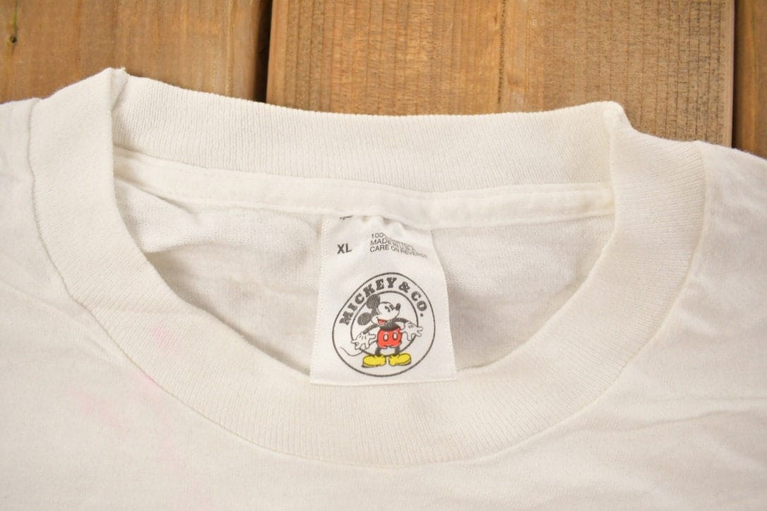 Vintage 1990s Mickey Mouse Surfer Graphic T Shirt Men's Large from propervintagecanada