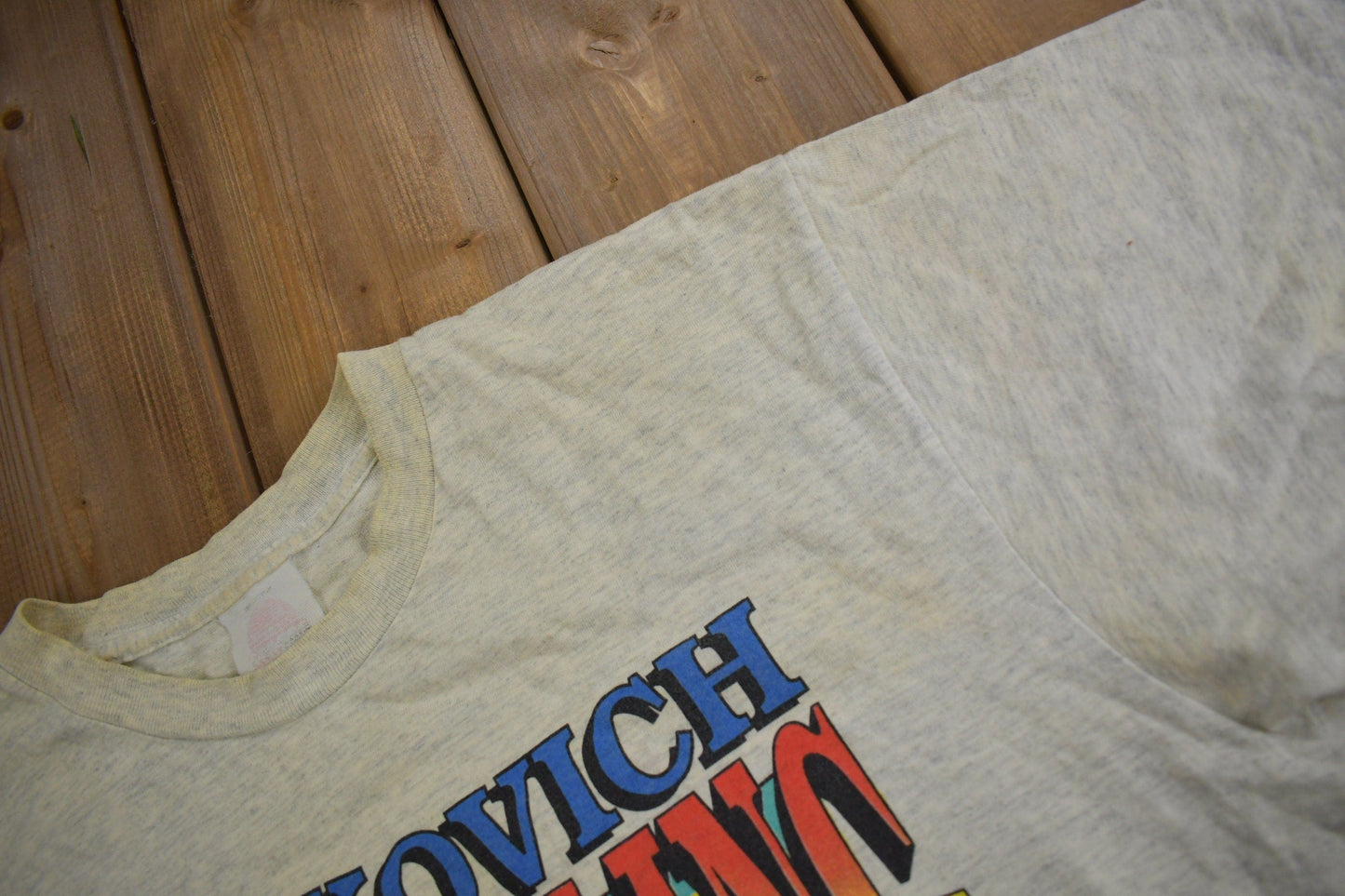 Vintage 1990s Milkovich Wrestling Conference Champions Graphic T Shirt Men's XL from propervintagecanada