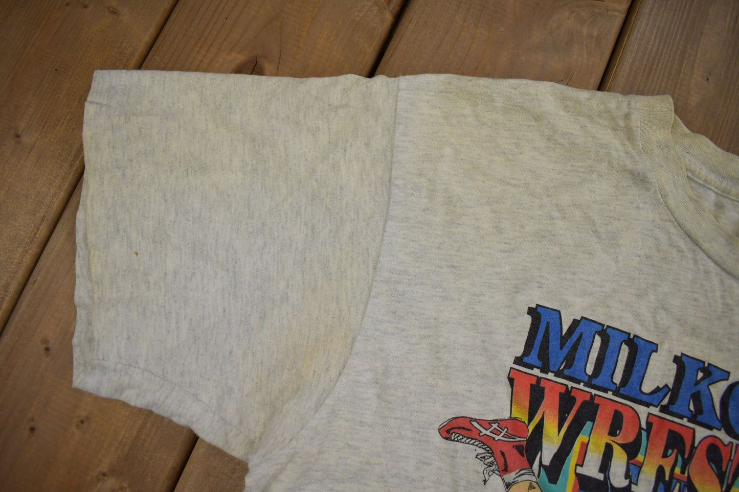 Vintage 1990s Milkovich Wrestling Conference Champions Graphic T Shirt Men's XL from propervintagecanada