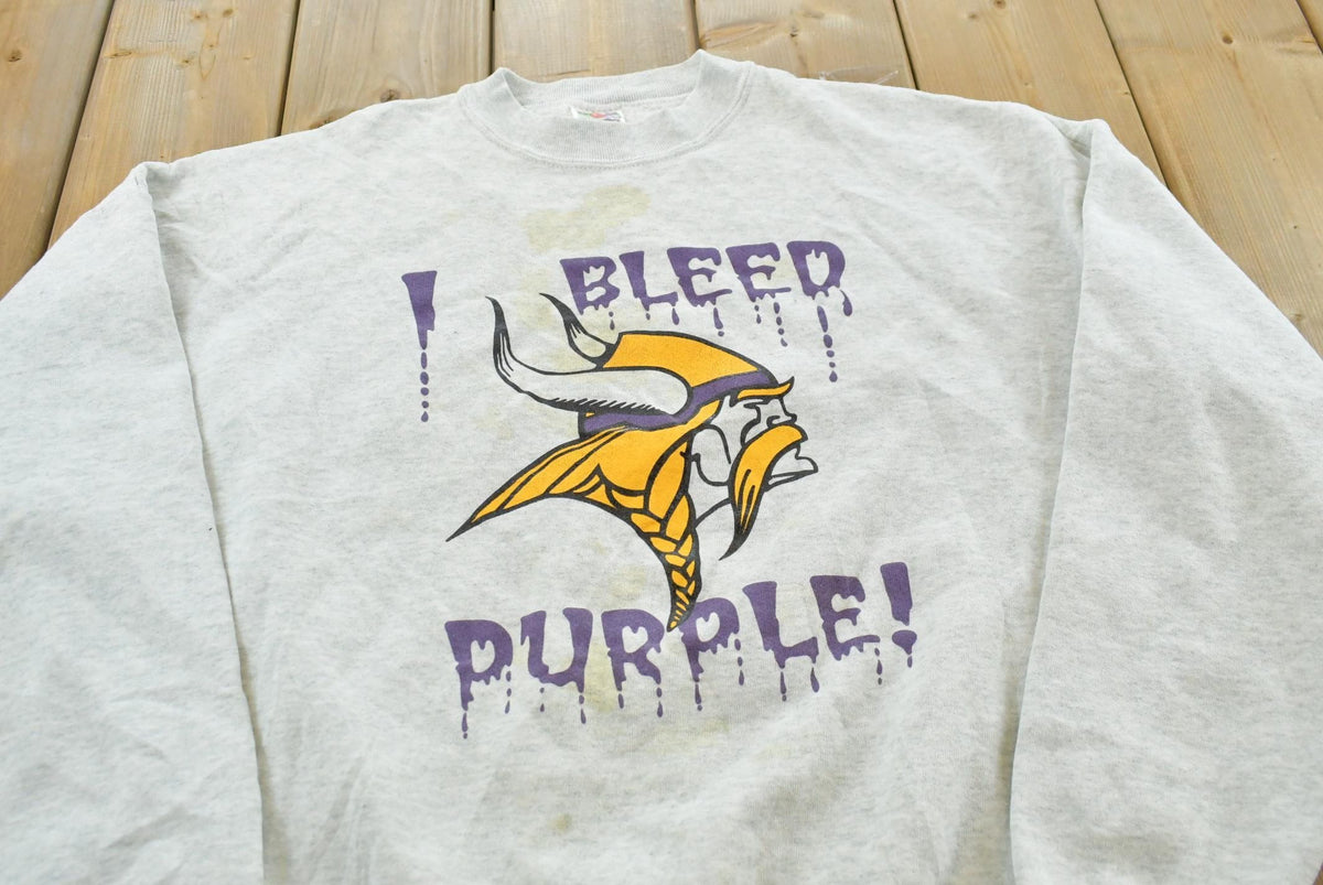 Vintage 1990s Minnesota Vikings I Bleed Purple NFL Crewneck Sweatshirt Mens M from propervintagecanada
