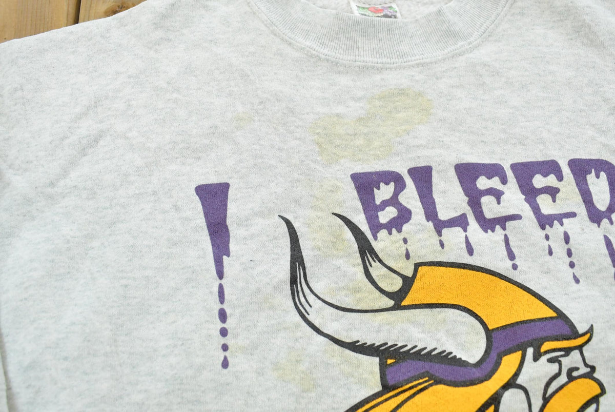 Vintage 1990s Minnesota Vikings I Bleed Purple NFL Crewneck Sweatshirt Mens M from propervintagecanada