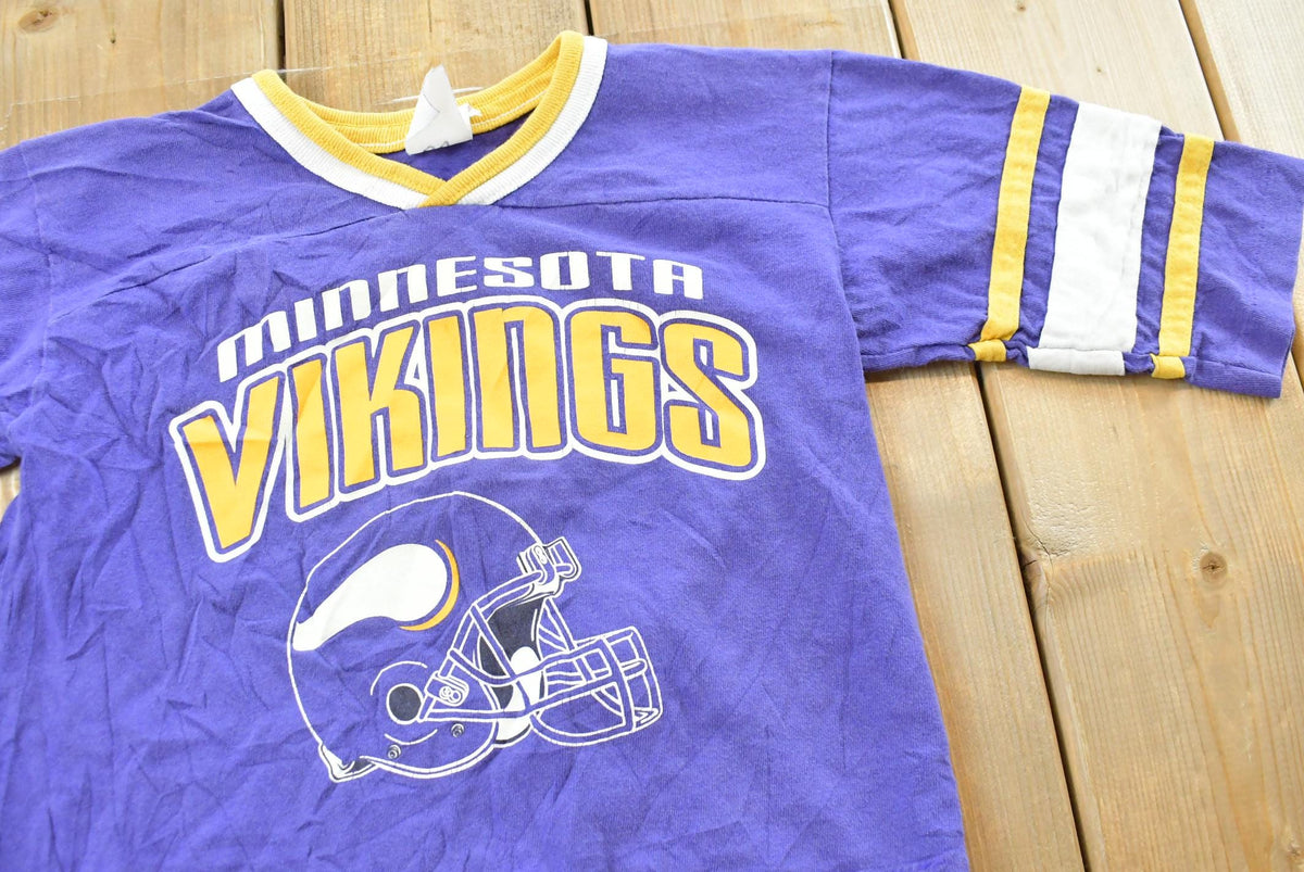 Vintage 1990s Minnesota Vikings NFL Graphic T-Shirt Youth XS from propervintagecanada